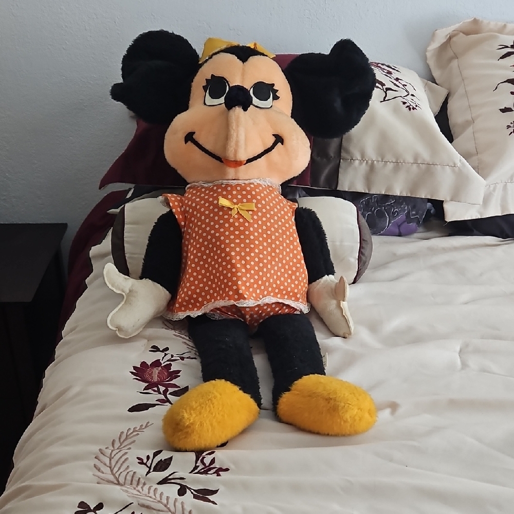 Disney Plush Toy with Orange Outfit and Yellow Shoes.